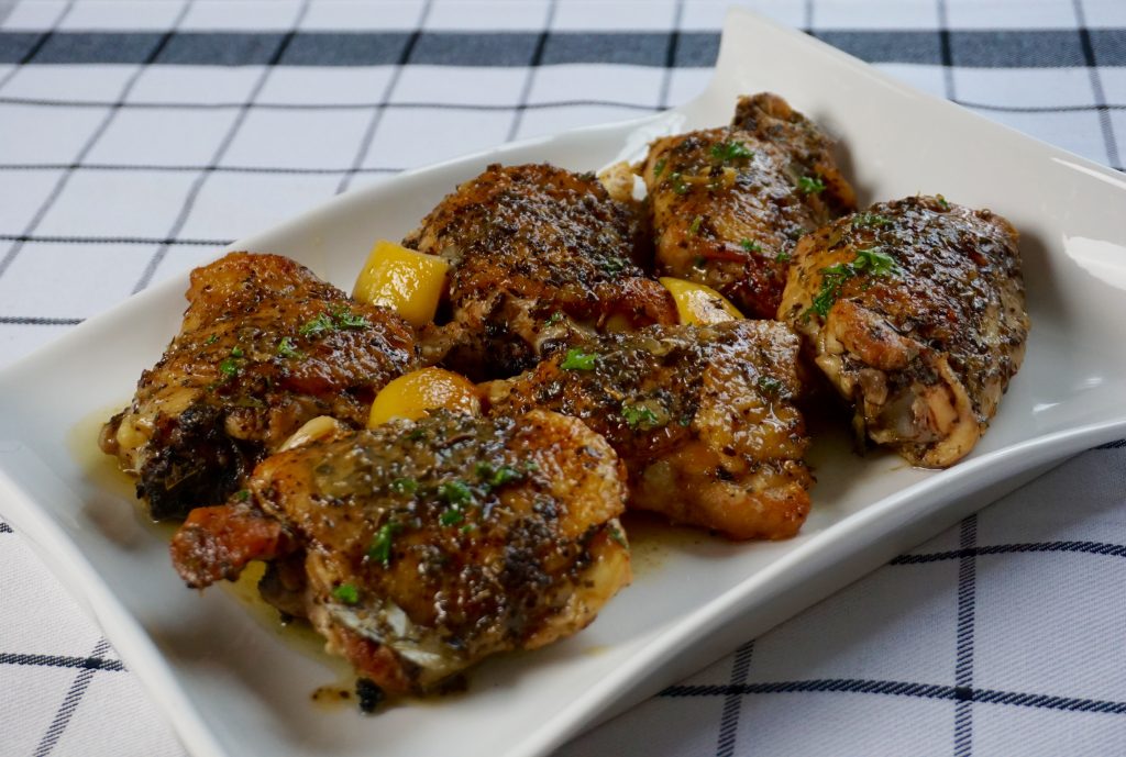 Lemon Chicken is roasted with lemon, garlic,wine and spices.