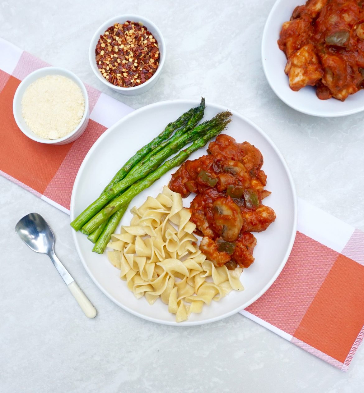 Chicken Cacciatore has a tomato wine sauce and bell pepper.