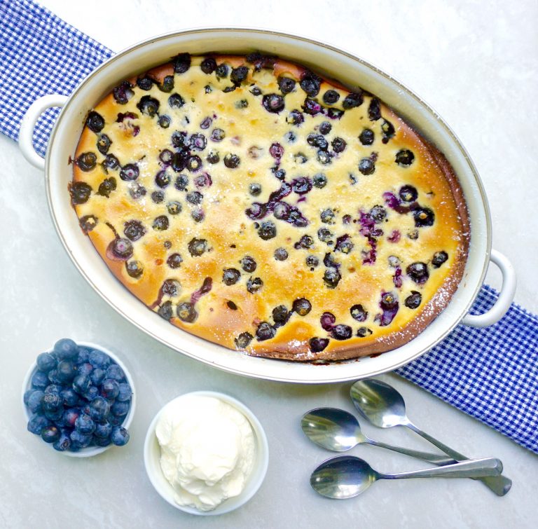 Blueberry Clafoutis is a baked dessert with fresh blueberries