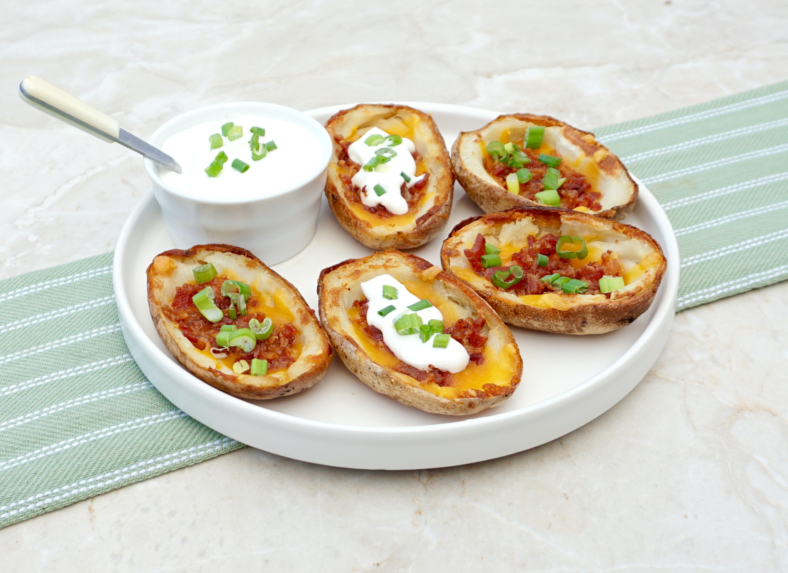 Oven Baked Potato Skins are crispy, cheesy and delicious.