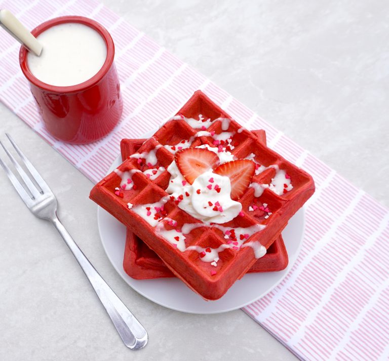 Festive Red Velvet Waffles with Cream Cheese Glaze