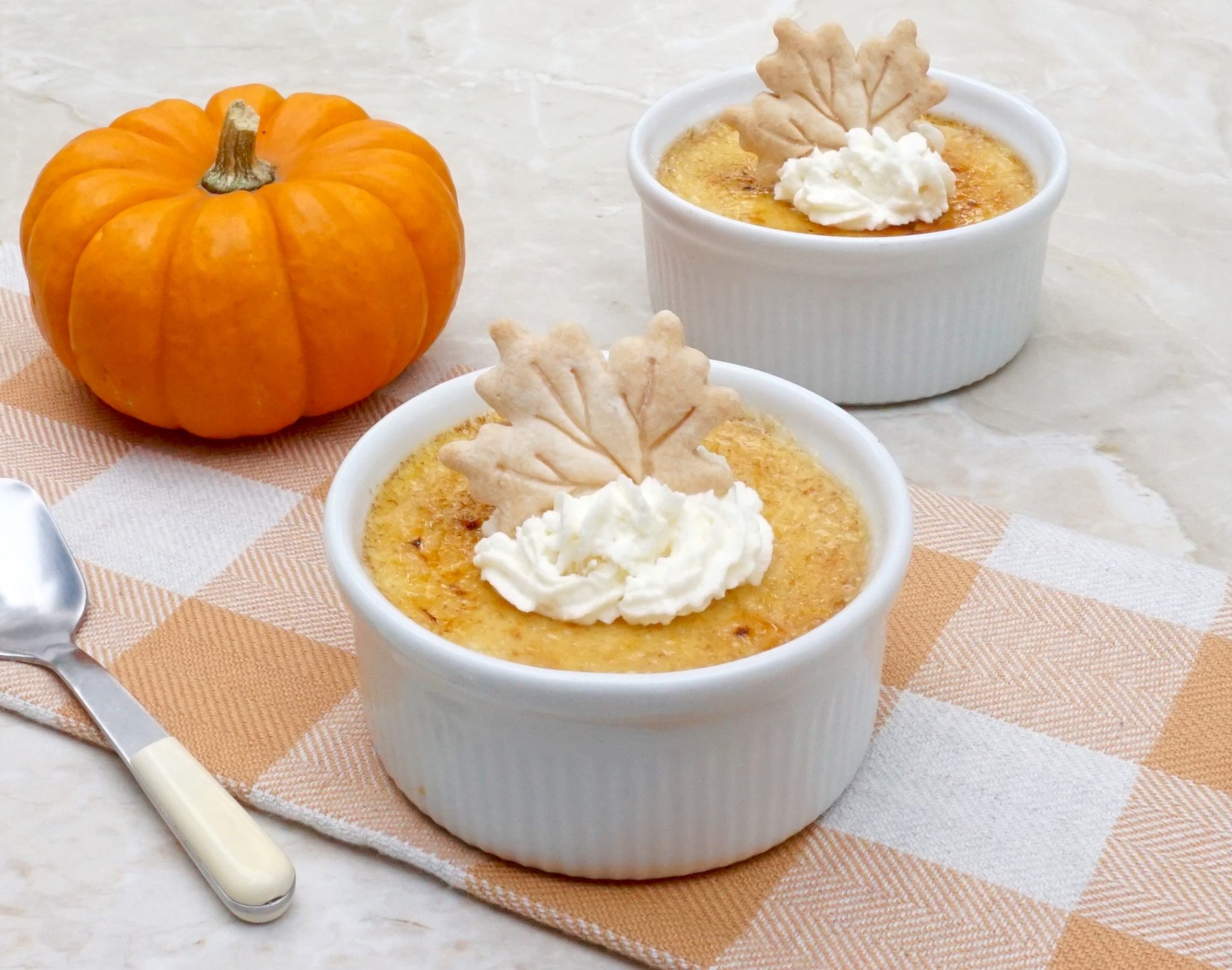 Pumpkin Creme Brûlée is a custard dessert with a caramelized top