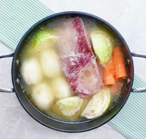 Corned Beef and vegetables in cooking pot.